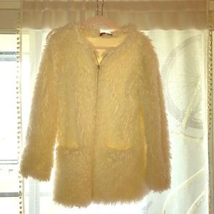 Furry/ fluffy white coat